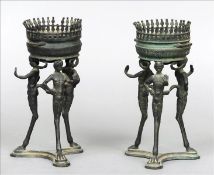 A pair of Grand Tour patinated bronze table stands The rounded tops of pierced castellated form,