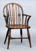 A late 18th century yewwood and elm Thames Valley Windsor chair The curved top rail above two