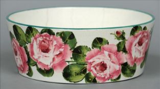 A Wemyss ware bowl, retailed by T. Goode & Co. The tapered sides decorated with pink roses. 28 cms