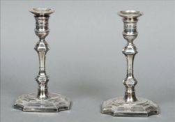 A pair of Edwardian silver candlesticks, hallmarked Sheffield 1904, maker`s mark of HE Ld The