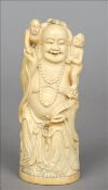 A late 19th century Chinese carved ivory figure of Buddha Formed holding a ruyi sceptre and with two