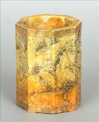 A Chinese carved soapstone brush pot Of octagonal section and extensively decorated with figures