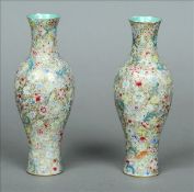 A pair of 19th century Chinese eggshell porcelain vases Each of slender bulbous form and decorated