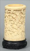 A 19th century Cantonese carved ivory tusk section vase Carved throughout with waring figures in a