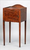 A 19th century mahogany pot cupboard The galleried square section top above a single cupboard door