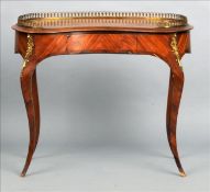 A 19th century ormolu mounted kingwood and mahogany kidney shaped writing table The galleried and