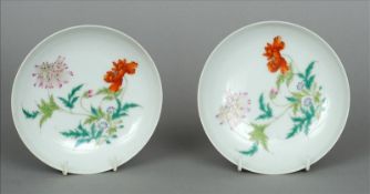 A pair of Chinese porcelain dishes Each decorated with floral sprays, blue painted six character