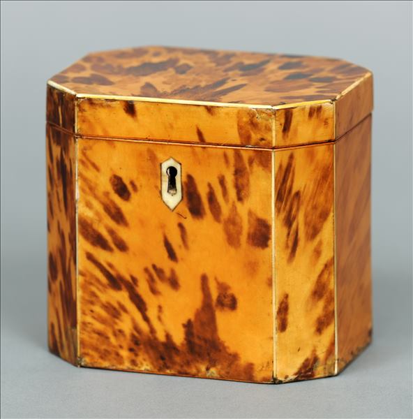 A George III blond tortoiseshell tea caddy Of rectangular form with canted corners, the hinged cover