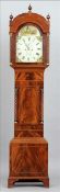 An early 19th century mahogany cased longcase clock The finial mounted hood enclosing a painted