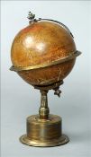 A rare 19th century Smiths Patent Empire clock, in the form of a globe Standing on a bronze base,