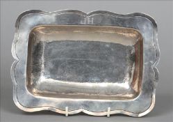 An 18th/19th century unmarked Continental silver salver The scalloped edge bordering the dished