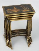 A chinoiserie lacquered quartetto nest of tables Each rectangular top decorated with a pagoda in a