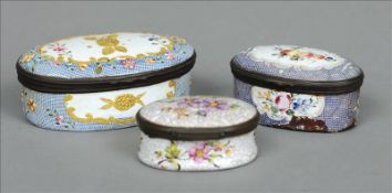 An 18th century enamelled snuff box Of oval form, decorated with fruit and flowers; together with