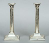 A pair of George V silver candlesticks, hallmarked Sheffield 1930, maker`s mark of TB & S Each of