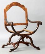 An 18th century Italian walnut open armchair The shaped back above twin scrolling open arms over