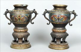 A pair of Chinese cloisonne decorated bronze vases Each twin handled vessel with bands of