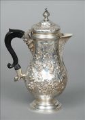 A Victorian silver coffee pot, hallmarked London 1900, maker`s mark of WSCS The finial mounted