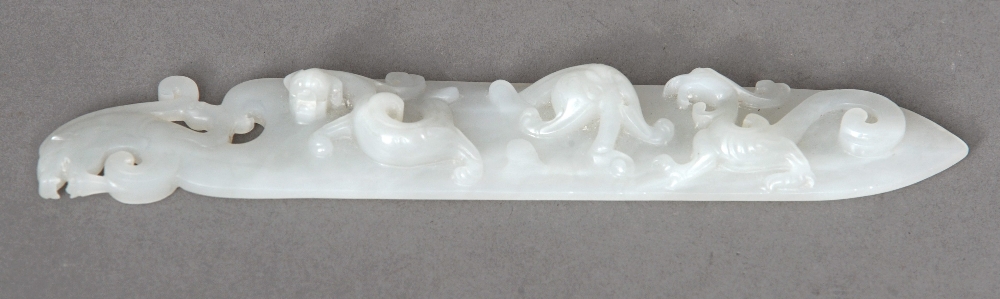 A Chinese white jade ceremonial knife The blade carved with stylised dragons opposing scrolls,