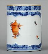 An 18th/19th century Chinese Export mug Decorated with a blue and white floral border and floral