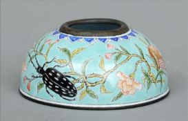 A Chinese enamel ink pot Decorated with an insect and fruit on a turquoise background, the underside