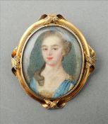 A small 18th century portrait miniature on ivory Depicting a young lady, set in a pierced unmarked