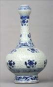 A Chinese porcelain onion vase Moulded with stylised Tibetan calligraphic characters on a celadon
