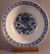 An 18th century Chinese blue and white porcelain plate. Together with a Chinese blue and white