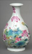A Chinese porcelain vase Of baluster form decorated with lotus flowers, blue painted six character
