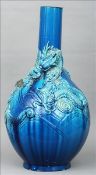 A large 19th century Japanese turquoise ground vase The main body decorated in relief with an