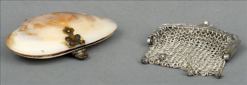 A Victorian purse Formed from an oyster shell, the polished exterior with brass catch enclosing