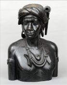 A large 19th century carved wooden bust, of an African tribesman, possibly Xhosa Carved wearing
