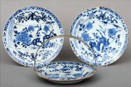 Three 18th/19th century Chinese blue and white plates One mounted with a white metal swing handle;