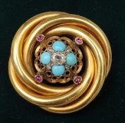 A Victorian unmarked gold brooch The twisted tubular frame bordering a pierced central section set