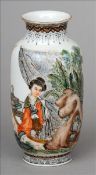 A Chinese porcelain vase Of small proportions, decorated with a female figure within a rocky