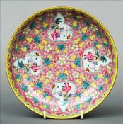 A Chinese porcelain dish The interior decorated with figural painted double gourd vignettes within