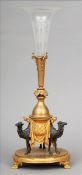 A 19th century patinated and gilt bronze centre piece The etched glass trumpet above the cast