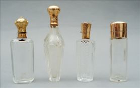 Four 19th century Continental gold topped scent bottles, marks indistinct Each of cut or faceted