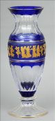 An early 20th century Continental blue and clear glass vase Of slender baluster form, decorated with