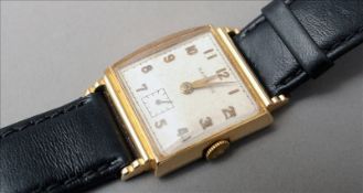 A Hamilton Watch Company 14 ct gold gentleman`s wristwatch The square dial with gilt Arabic numerals
