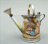 A 19th century Continental white metal mounted and enamelled miniature watering can, possibly Vienna