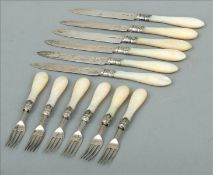 A set of Edwardian mother-of-pearl handled silver cutlery, hallmarked London 1905, maker`s mark of