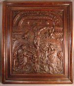 A 16th/17th century Continental carved oak panel Carved in relief with figures at the crucifixion of