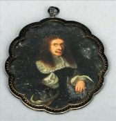 A 17th century Continental portrait miniature Of a gentleman, on copper, in white metal shaped frame
