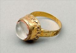 A Roman/Byzantine unmarked yellow metal glass intaglio set ring The lobed insert above a decorated