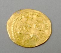 An early gold coin Decorated to one side with a king and queen. Approximately 2 cms diameter.
