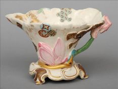 A Royal Worcester jug The main body organically formed and with enamelled geometric decorations,