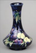 A Moorcroft Wisteria pattern vase The flared neck rim above the spreading squat base, standing on