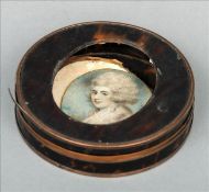A late 18th/early 19th century tortoiseshell box Of circular form with yellow metal banding, the lid