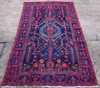 A Hamadan wool rug 297 x 130 cms.