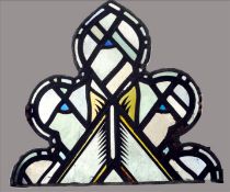 A pair of antique leaded stained glass panels Each of arched trefoil outline. 62 x 54 cms. (2)